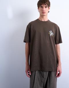 Model wearing Oversized Pegasus embroidered t-shirt with back text in brown