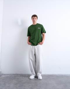 Model wearing Oversized Shibuya print t-shirt in dark green
