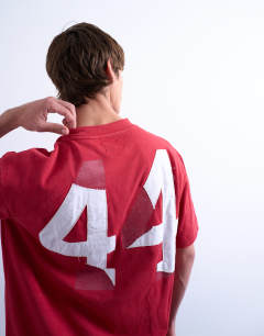 Model wearing Oversized t-shirt with Illinois front and back print in red