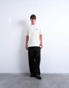 Model wearing Oversized t-shirt with Mid West League back embroidery in ecru
