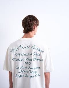 Model wearing Oversized t-shirt with Mid West League back embroidery in ecru