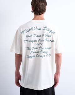 Model wearing Oversized t-shirt with Mid West League back embroidery in ecru