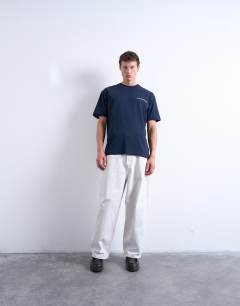 Model wearing Oversized Union Atelier embroidered t-shirt in navy
