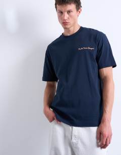 Model wearing Oversized Union Atelier embroidered t-shirt in navy