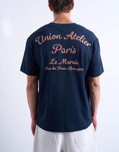 Model wearing Oversized Union Atelier embroidered t-shirt in navy