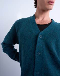 Model wearing Oversized v neck cardigan in dark green