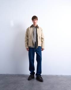 Model wearing Padded canvas jacket in washed stone