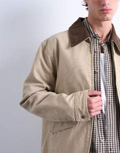 Model wearing Padded canvas jacket in washed stone