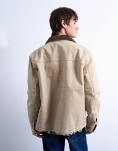 Model wearing Padded canvas jacket in washed stone