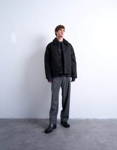 Model wearing Padded coach jacket with borg collar in black