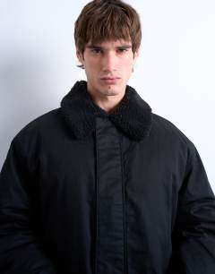 Model wearing Padded coach jacket with borg collar in black