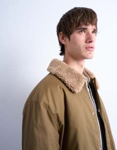 Model wearing Padded coach jacket with borg collar in stone