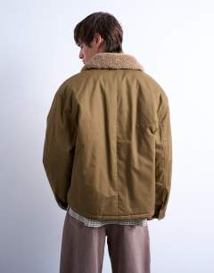 Model wearing Padded coach jacket with borg collar in stone