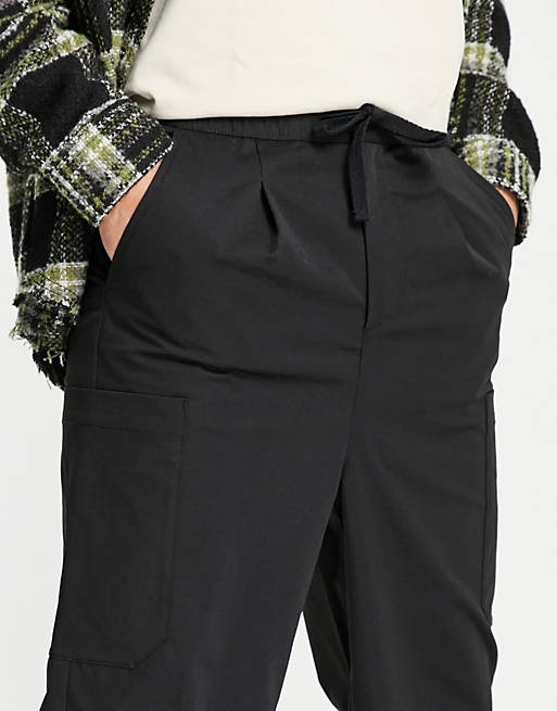 Pantaloni cargo taglio corto a fondo ampio neri Asos Uomo Abbigliamento Pantaloni e jeans Pantaloni Pantaloni a zampa 