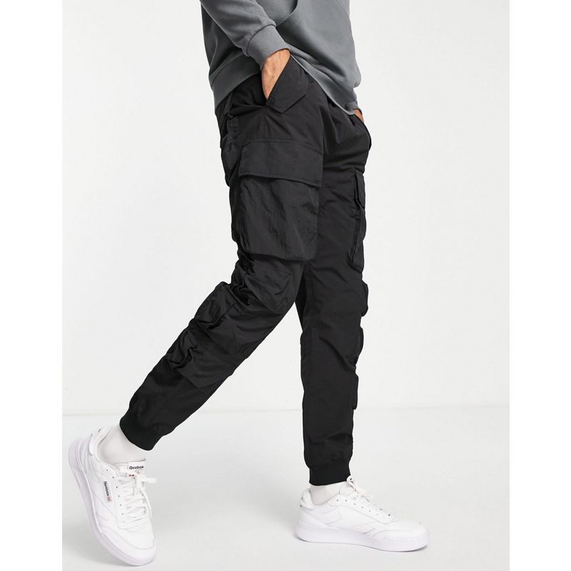 Pantaloni e chino Pantaloni cargo Topman - Pantaloni comodi in nylon neri con tasche cargo