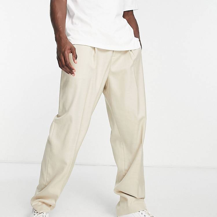 Pantaloni da abito con fondo ampio e pieghe color pietra Asos Uomo Abbigliamento Pantaloni e jeans Pantaloni Pantaloni a zampa 