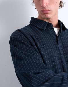 Model wearing Pinstripe button through polo in navy