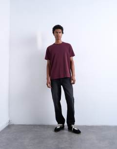 Model wearing Premium classic fit t-shirt in burgundy