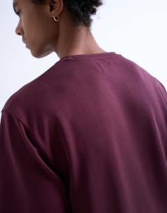 Model wearing Premium classic fit t-shirt in burgundy
