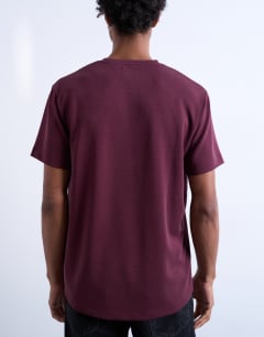 Model wearing Premium classic fit t-shirt in burgundy