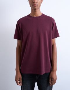 Model wearing Premium classic fit t-shirt in burgundy