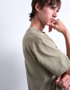 Model wearing Premium cropped fit t-shirt in khaki