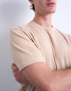 Model wearing Premium heavyweight rib tee in camel