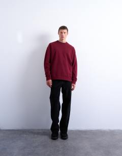 Model wearing Premium lightweight oversized fit sweatshirt in burgundy