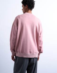 Model wearing Premium oversized drop shoulder sweatshirt in washed pink