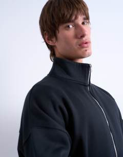 Model wearing Premium oversized fit  1/4 zip funnel neck in black