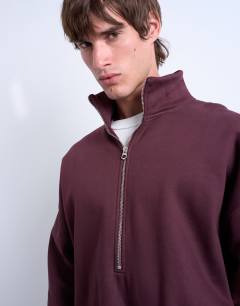 Model wearing Premium oversized fit 1/4 zip funnel neck in burgundy