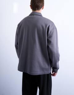 Model wearing Premium oversized fit 1/4 zip polo in grey