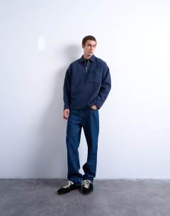 Model wearing Premium oversized fit 1/4 zip polo in navy