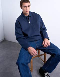 Model wearing Premium oversized fit 1/4 zip polo in navy