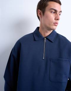 Model wearing Premium oversized fit 1/4 zip polo in navy