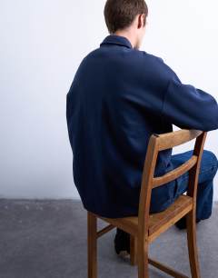 Model wearing Premium oversized fit 1/4 zip polo in navy