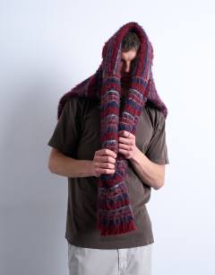 Model wearing Premium oversized fit t-shirt with nowhere embroidery in washed brown