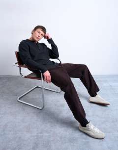 Model wearing Premium relaxed fit heavyweight waffle henley in black