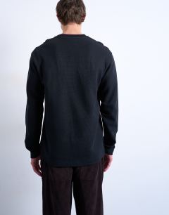 Model wearing Premium relaxed fit heavyweight waffle henley in black