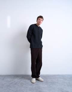 Model wearing Premium relaxed fit heavyweight waffle henley in black