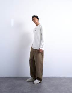 Model wearing Premium relaxed fit heavyweight waffle henley in ecru