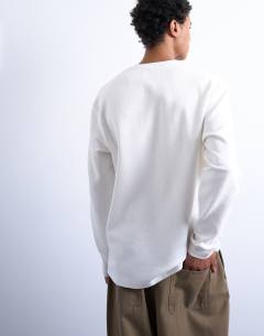 Model wearing Premium relaxed fit heavyweight waffle henley in ecru