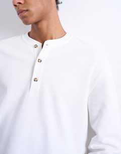 Model wearing Premium relaxed fit heavyweight waffle henley in ecru