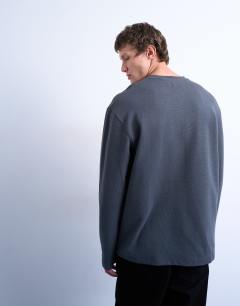 Model wearing Premium relaxed fit heavyweight waffle henley in grey