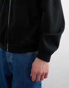 Model wearing Premium relaxed fit knitted double zip cardigan in black