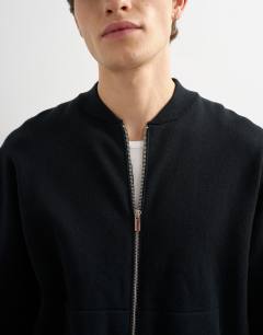 Model wearing Premium relaxed fit knitted double zip cardigan in black