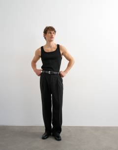 Model wearing Premium square neck ribbed vest in black