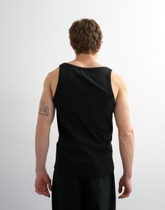 Model wearing Premium square neck ribbed vest in black