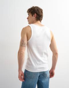Model wearing Premium square neck ribbed vest in white