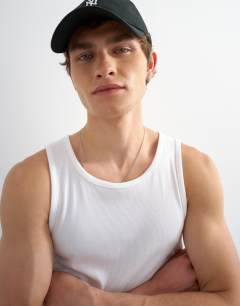 Model wearing Premium square neck ribbed vest in white